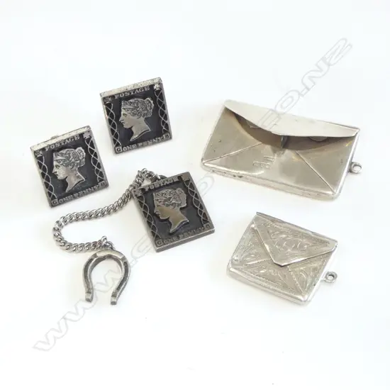 Two silver stamp 'envelopes',