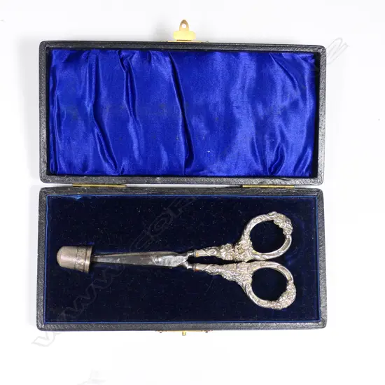 A cased pair of sterling silver scissors and thimble, Birmingham 1906,