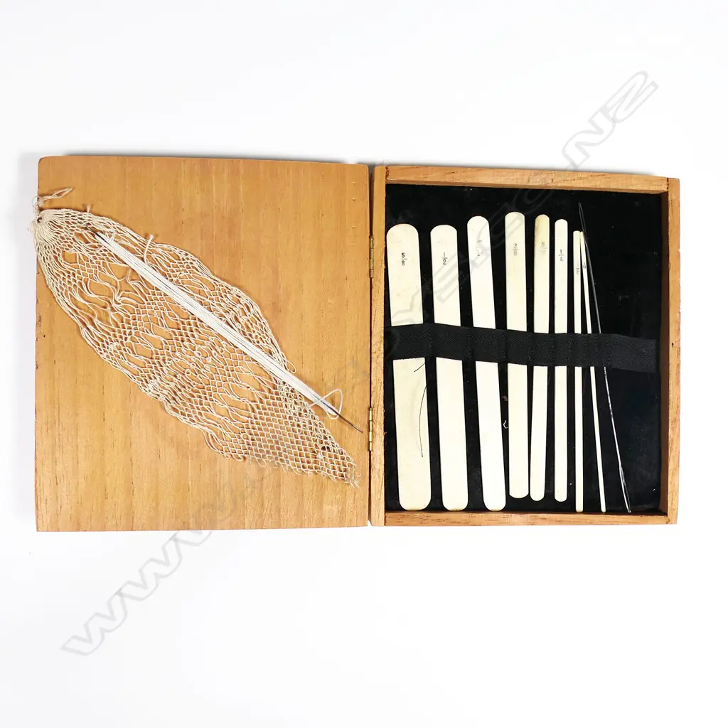 A box of bone netting tools, and two steel netting shuttles. Image 1++
