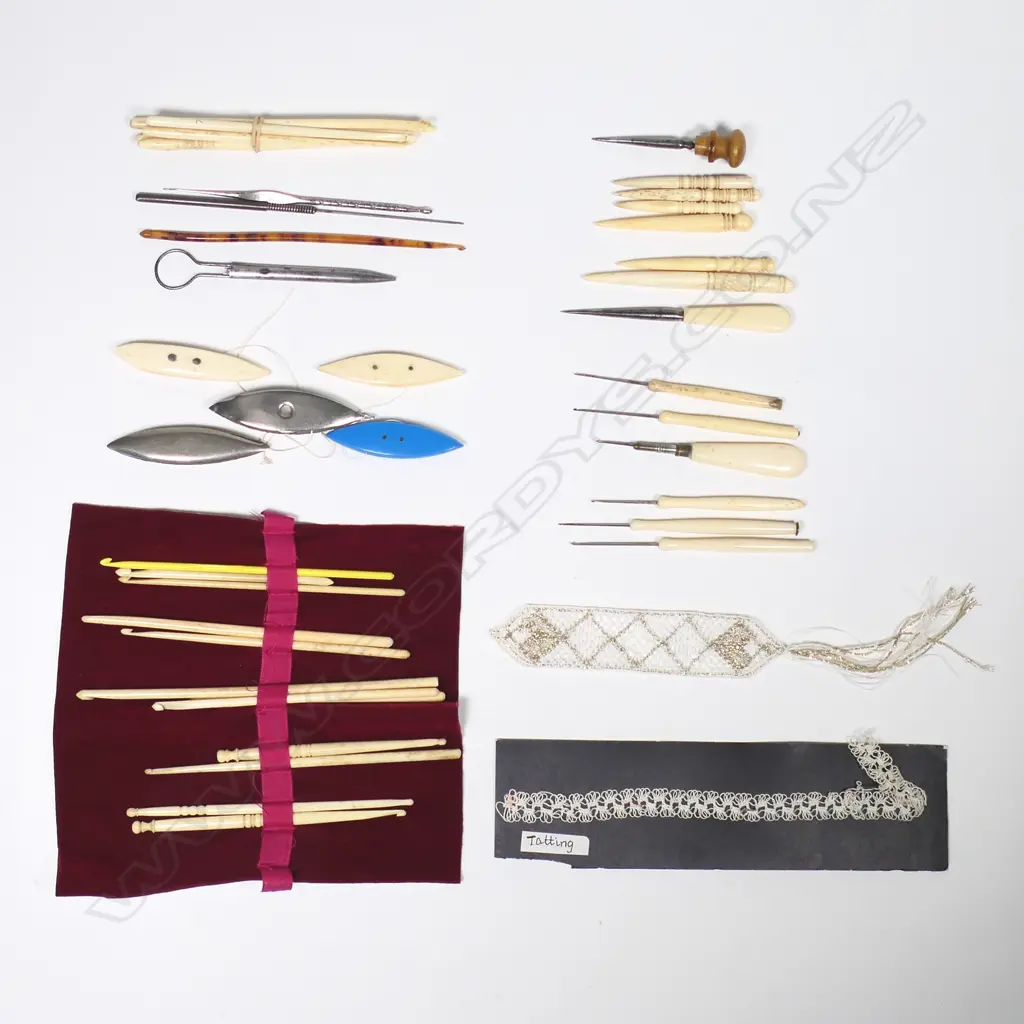 A collection of bone tatting shuttles, bone handled tambour hooks and stilettos, bone crochet hooks and other tools. Image 1++