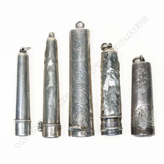 A collection of five silver cigarette holder cases,