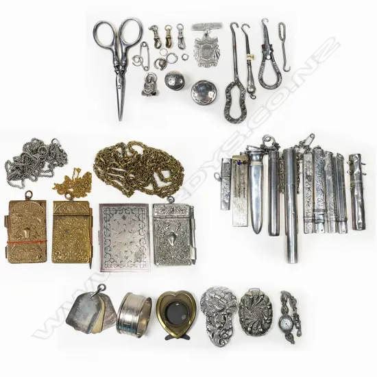 A large selection of chatelaine objects; notebooks, chains, scabbards, pencil holders, etc. Silver and other materials.