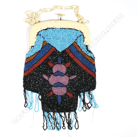 A French Art Deco period beaded handbag with ivorine plastic frame,