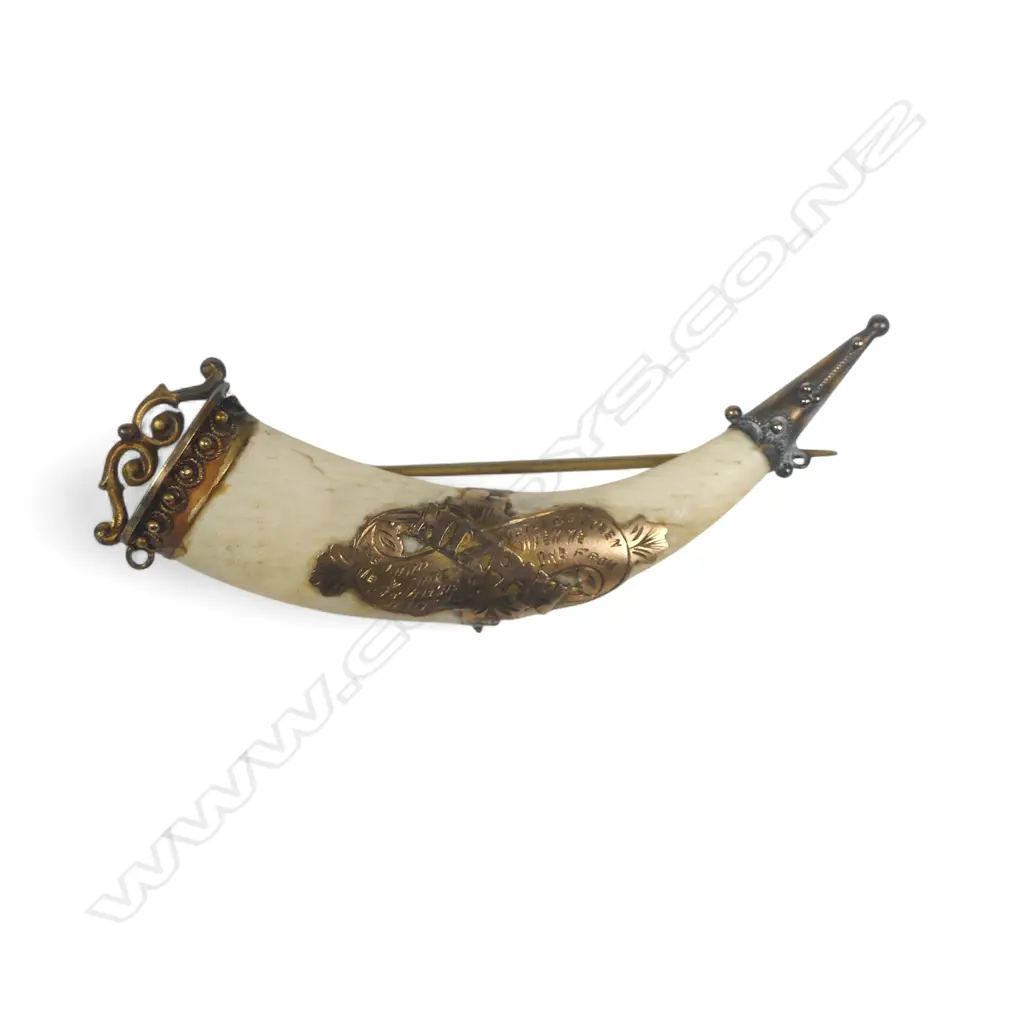 An ivory tusk shape brooch with 9ct gold MIZPAH mount and capped ends. L.60mm Image 1++