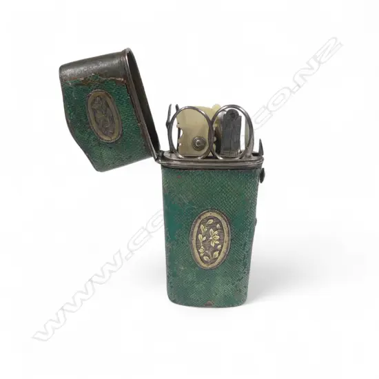 A Georgian period silver mounted emerald green fish skin bound étui, with comprehensive contents,