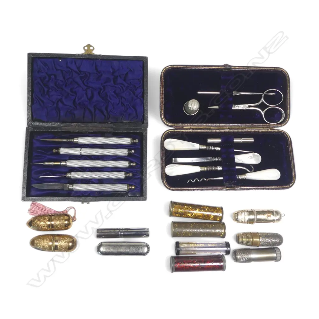 Two cased lady's sewing compendiums, leather and leatherette cased, and a collection of various tube cases holding bobbins, thimbles and needles Image 1++