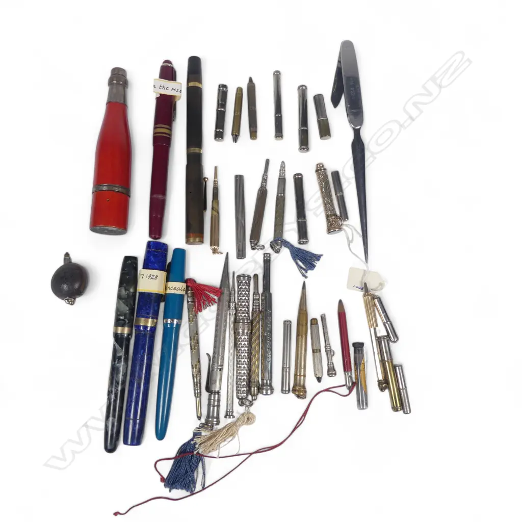 A collection of assorted fountain pens, propelling pencils, lead cases, etc. Image 1++