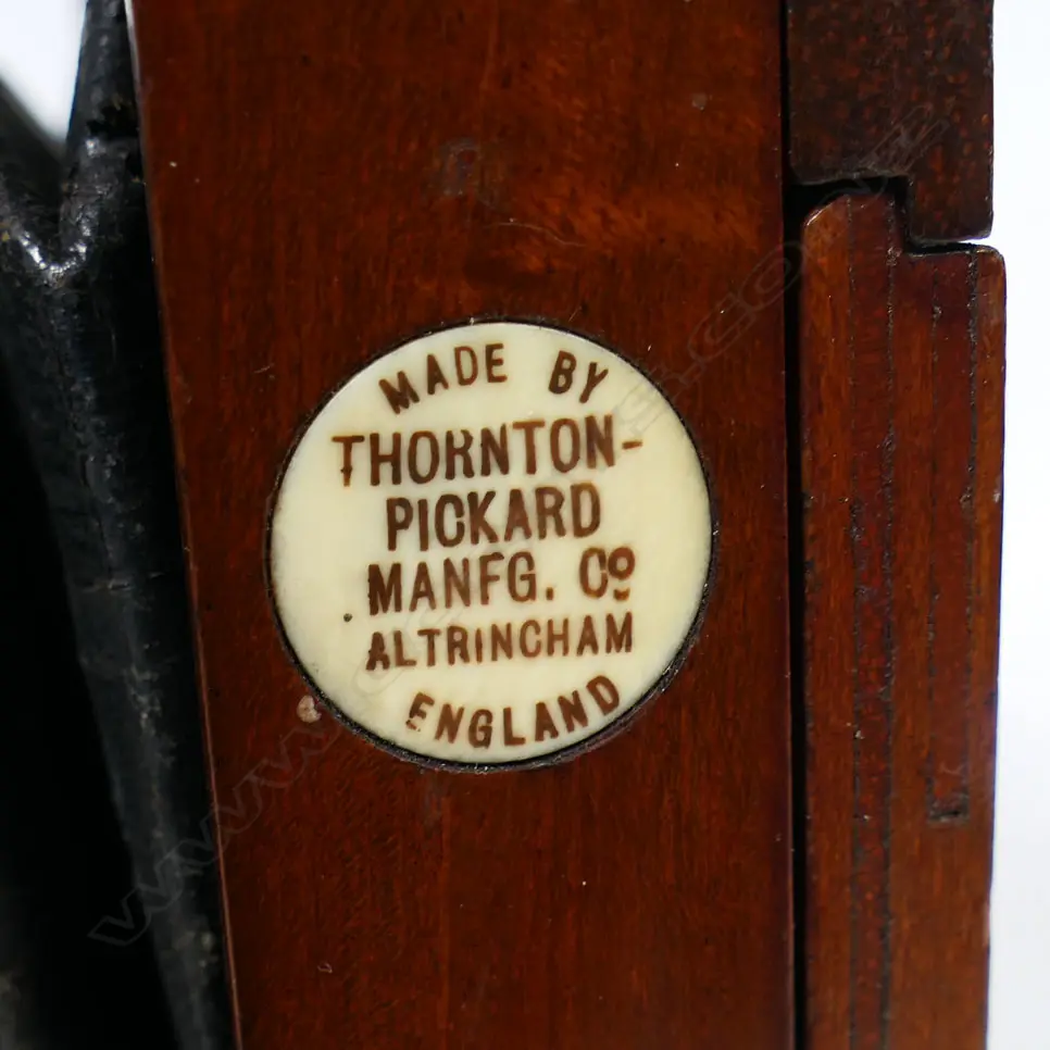 Thornton-Pickard extension timber and brass framed half-plate bellows camera.  Retailed by Baker & Rouse (Australia), fitted with Beck symmetrical lens with roller blind shutter with cable release. Circa 1910. Some holes to leather bellows Image 1++