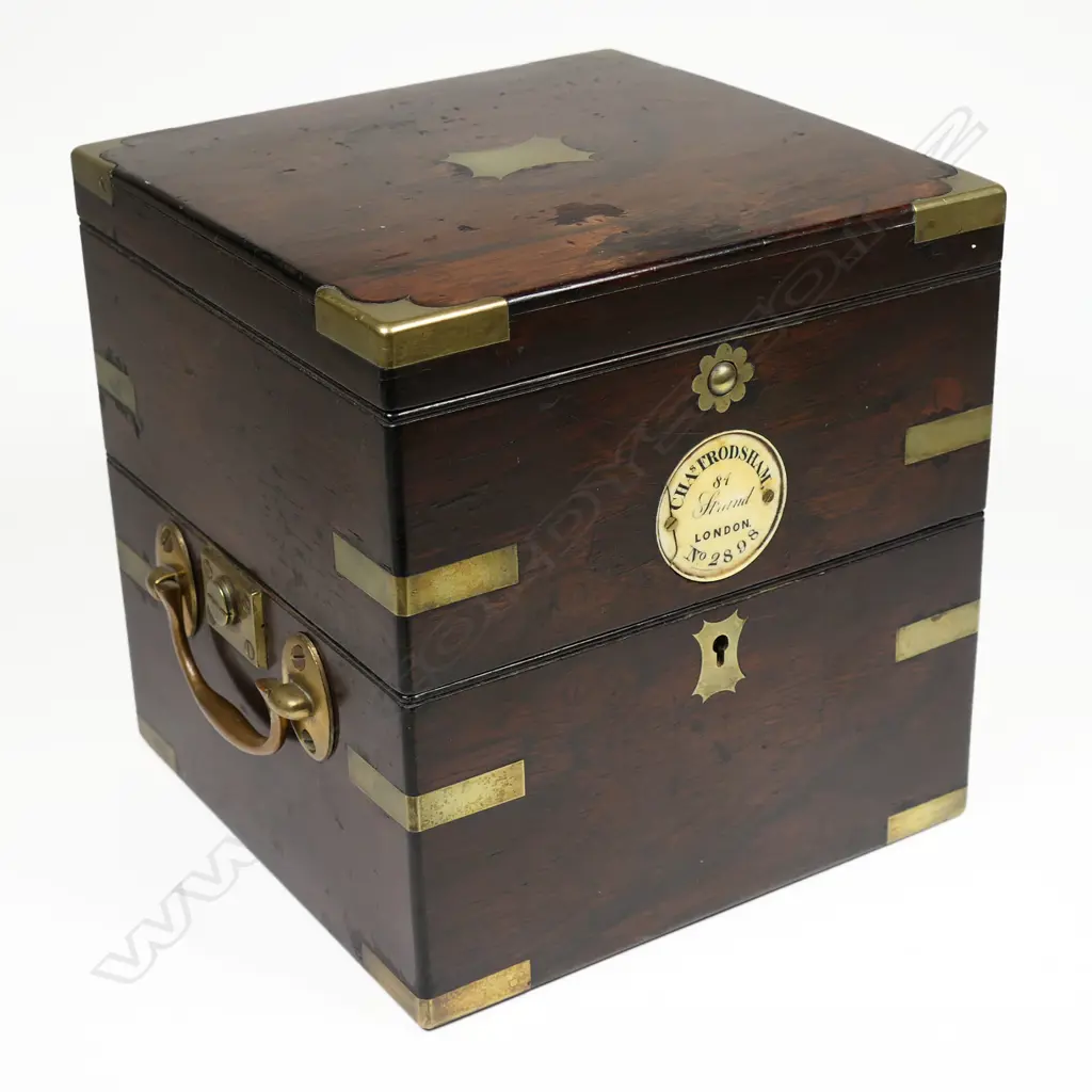 A 19thC two-day marine chronometer by Charles Frodsham, 84 Strand London, No.2898, c.1858, running, in dark mahogany three-piece case with brass capping and binding and folding carry handles. Image 1++