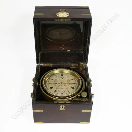 A 19thC two-day marine chronometer by Charles Frodsham, 84 Strand London, No.2898, c.1858, running, in dark mahogany three-piece case with brass capping and binding and folding carry handles.