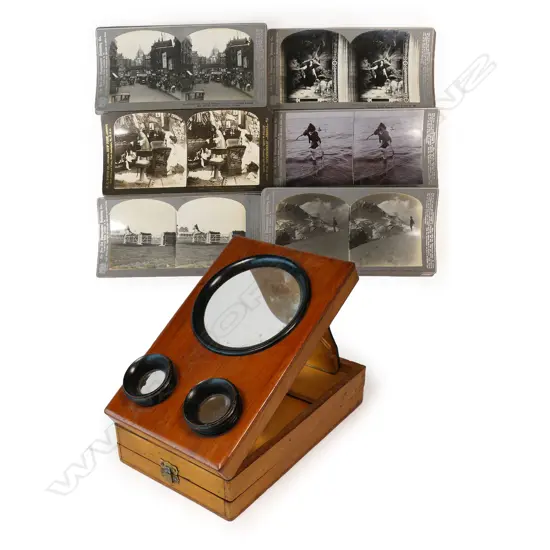 A folding tabletop magnifying stereoscopic photograph and cartes de visite viewer, plus a box of stereoscope cards,