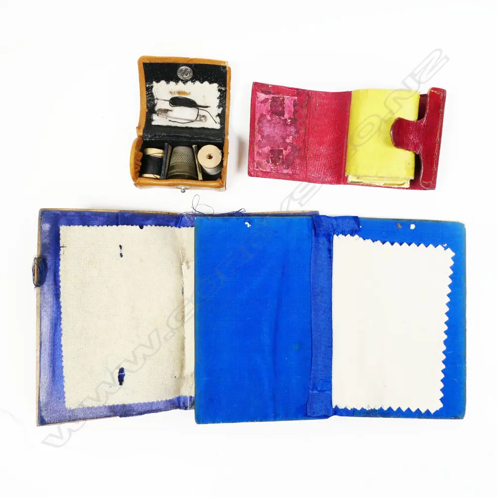 Two fruitwood faced needle books and two miniature leather sewing kits and a Nouveau needle holder, Image 1++