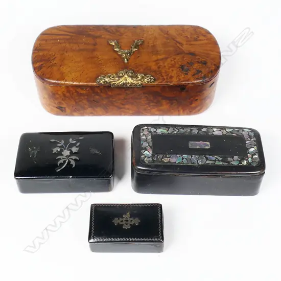 Four various snuff boxes, the largest of burr walnut with gilt metal thumb-piece and stag-head crest, W.100mm,