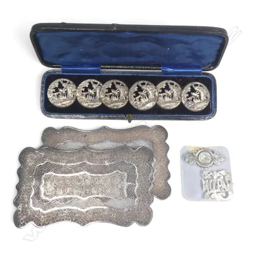 Two Oriental unmarked filigree silver? pillow end plates, two brooches and a cased set of silver plated buttons,