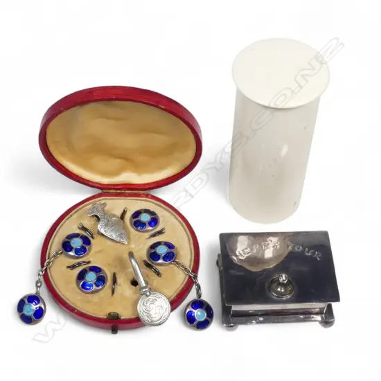 A set of American silver cufflinks and studs; two silver napkin clasps, an EP stud box and a cylindrical ivory canister,