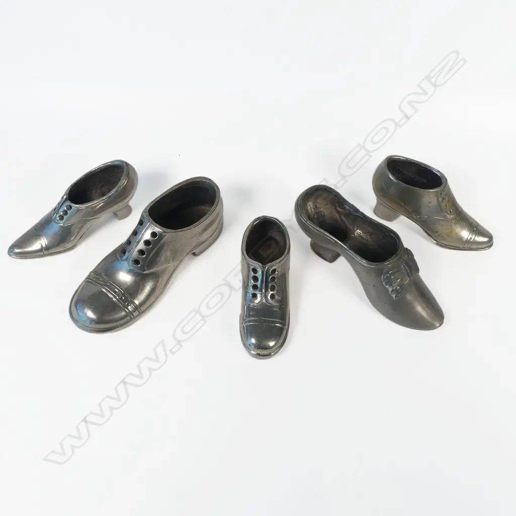 Five various metal shoe shaped pincushions Image 1++