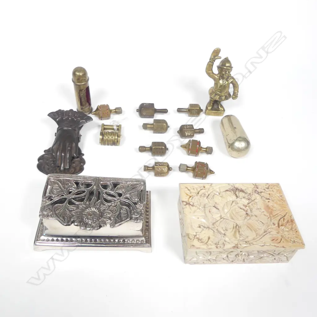 A collection of miscellany including stamp boxes, a metal hand letter clip, Put and Take games spinners, metal canisters, figure, etc. Image 1++