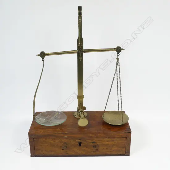 A  late Victorian oak box based brass set of balance scales, by P. Rogers & Co, To Weigh 2 Ozs,