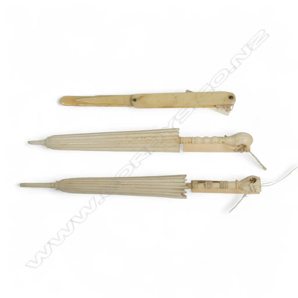 Three bone Stanhopes (lacking the views) - two of parasol shaped needle cases and a folding manicure implement. Image 1++