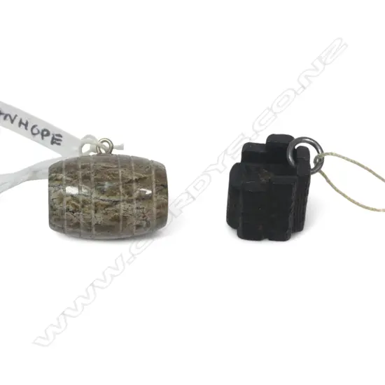 Two souvenir fob Stanhopes, one barrel shape of red serpentine stone with views of Cornwell, the other of black oak 'chimneys' with views of the Giants Causeway, coastal Ireland