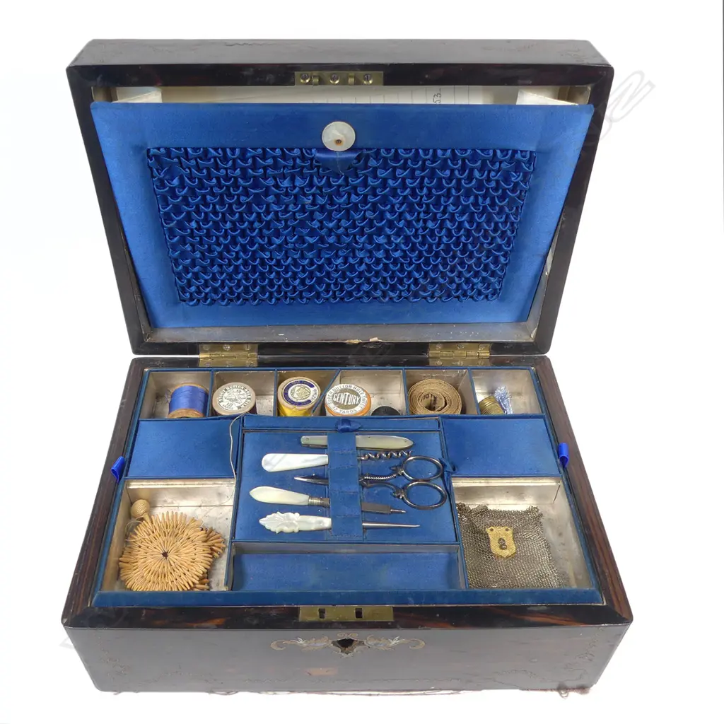 A Victorian ebony grained work box with glass reverse print inset top, (glass faulted), interior fitted with Mother of pearl handled implements and with original owner's details. W.305mm Image 1++