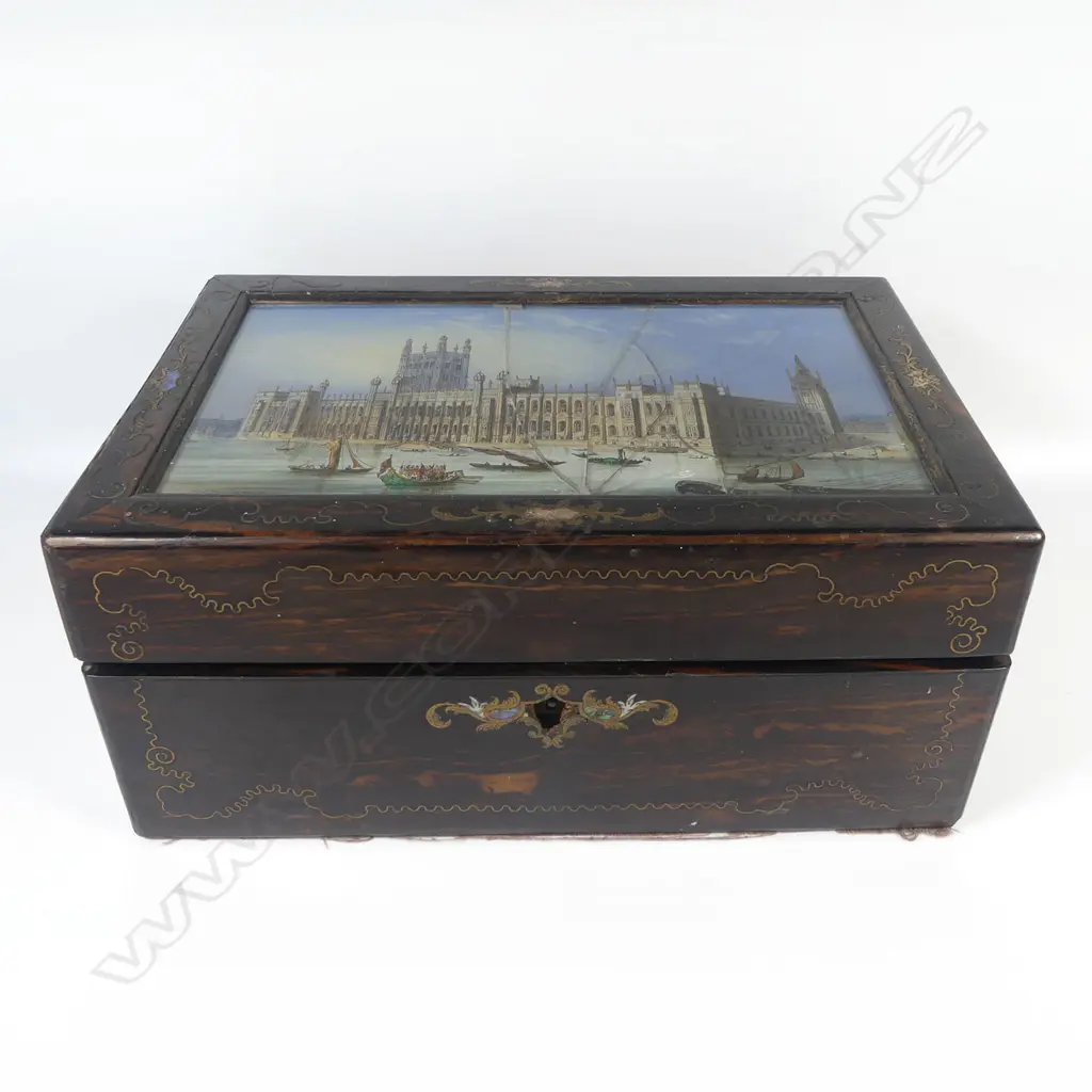 A Victorian ebony grained work box with glass reverse print inset top, (glass faulted), interior fitted with Mother of pearl handled implements and with original owner's details. W.305mm Image 1++