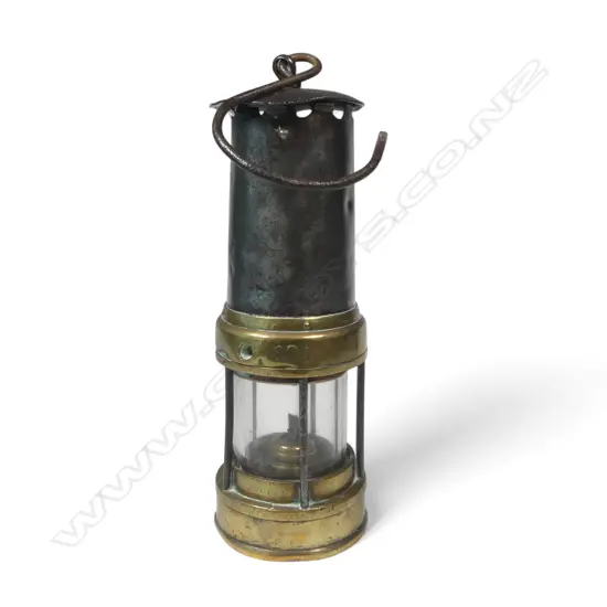 A 19thC Welsh miner's safety lamp, stamped with Prince of Wales feathers crest to steel chimney,