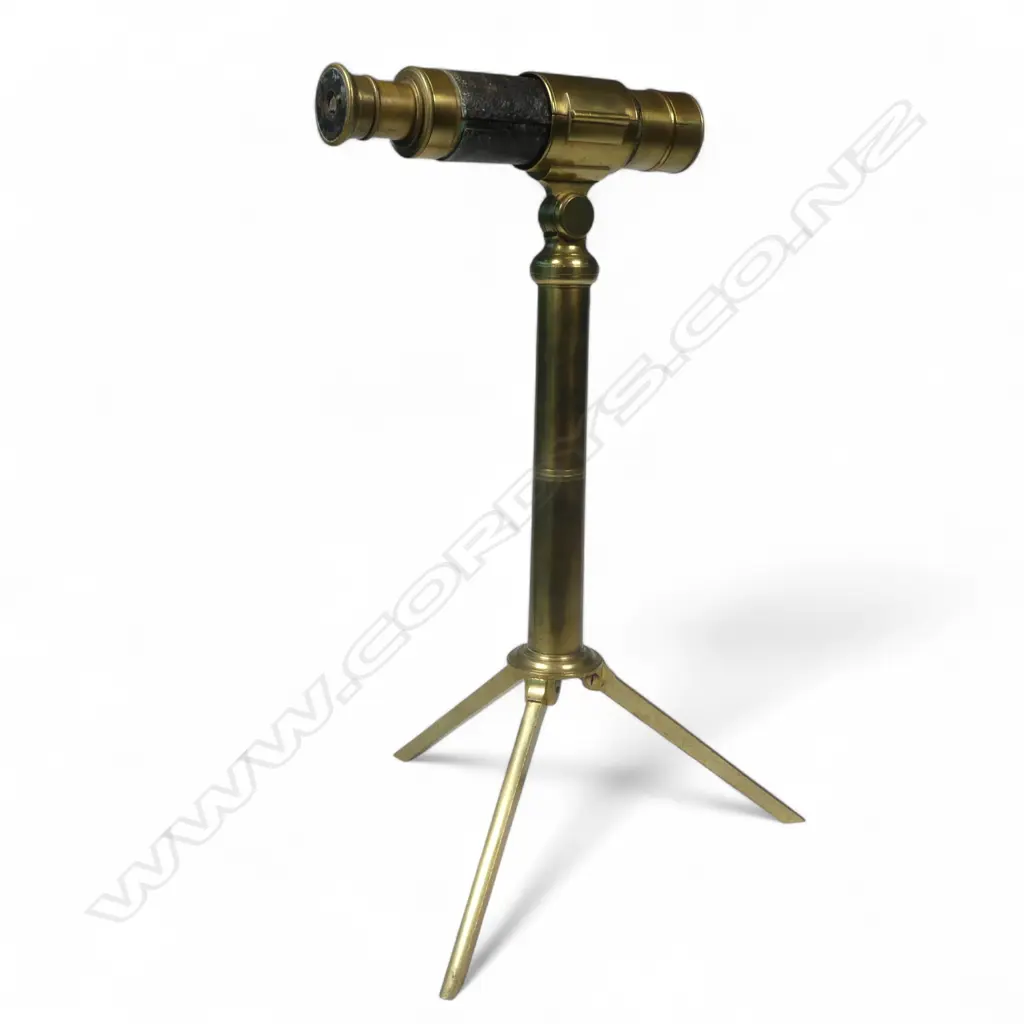 An interesting small three draw telescope (6" closed), fitted to a brass column and tripod base, Image 1++