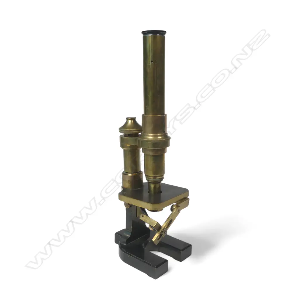19thC brass monocular compound microscope, the tube marked England 3745, fixed table with adjustable mirror, on lacquered spur shaped foot. Image 1++