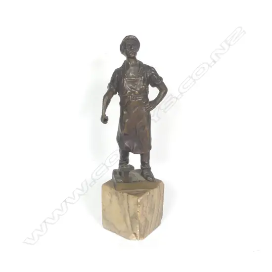A small bronze sculpture by Ludwig Gräfner (German 1861-1939), Blacksmith and anvil (hammer absent), signed, on alabaster plinth H.210mm