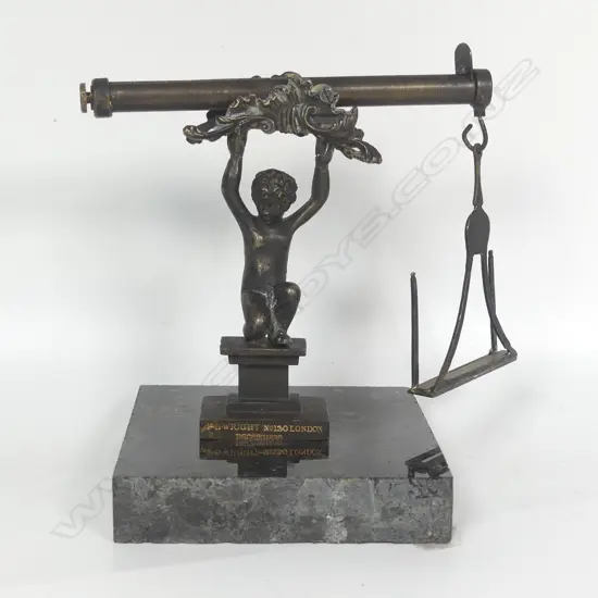 An ornamental table top early Victorian figural postal balance scale by H.B. Wright London