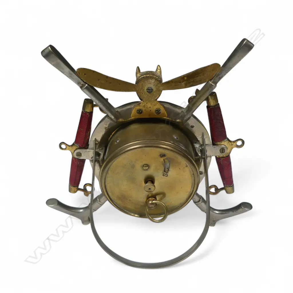 A decorative fox hunt themed mantel clock, with case framed by a horseshoe, riding crops, hanes and foxed. Mechanism at fault. H.180mm Image 1++