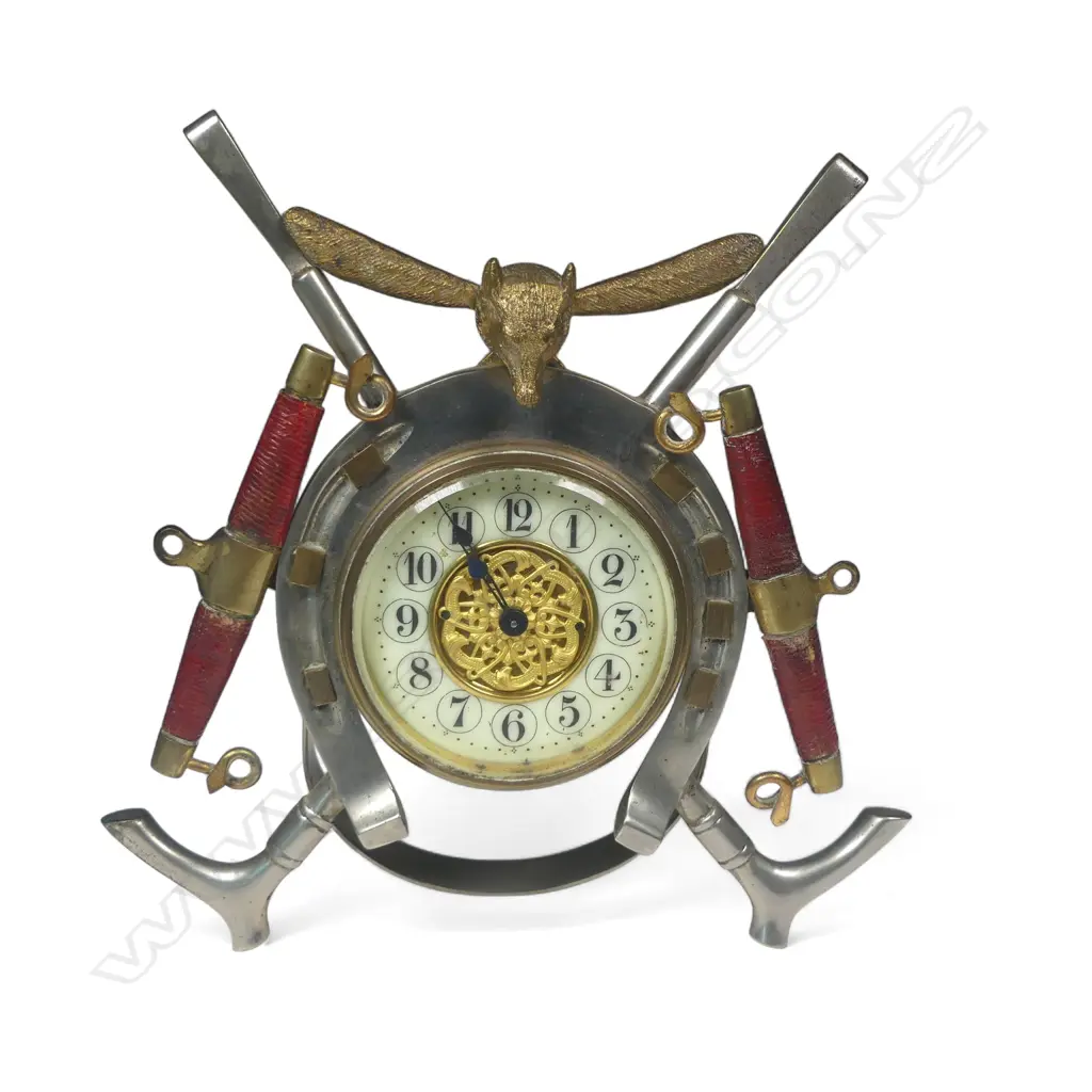 A decorative fox hunt themed mantel clock, with case framed by a horseshoe, riding crops, hanes and foxed. Mechanism at fault. H.180mm Image 1++