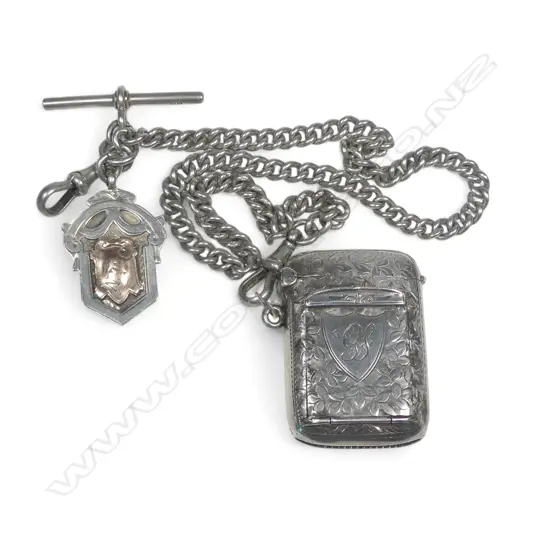 An Edwardian silver combination stamp box / vesta, Birmingham 1907 by John Gilbert, on chain with silver shield medallion fob. Total 65gm