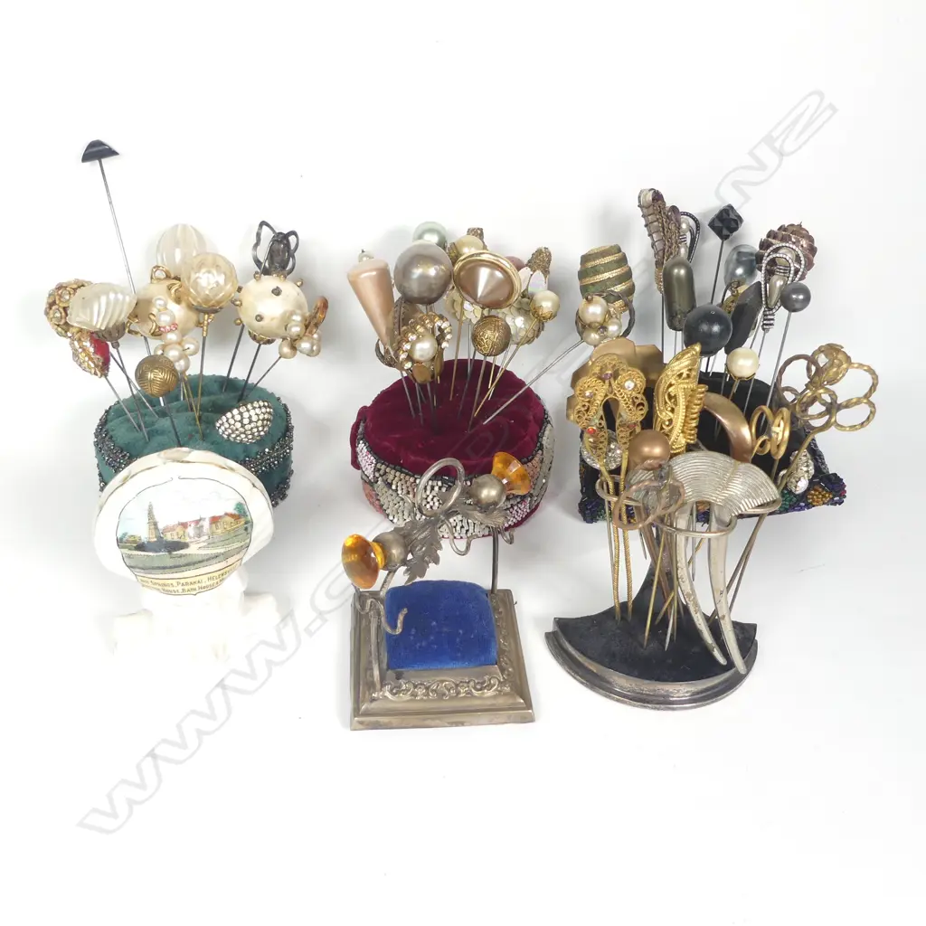 Three hat pin stands, three hat pin cushions and collection of hat pins. Image 1++