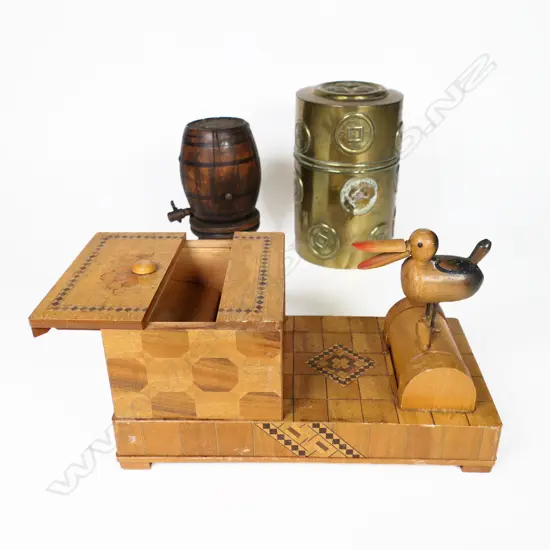 An Oriental brass tea caddy canister a novelty 'pecking bird' cigarette box and a novelty barrel shaped vesta whereby depressing the tap causes 12 matches to elevate from the top. H.110mm