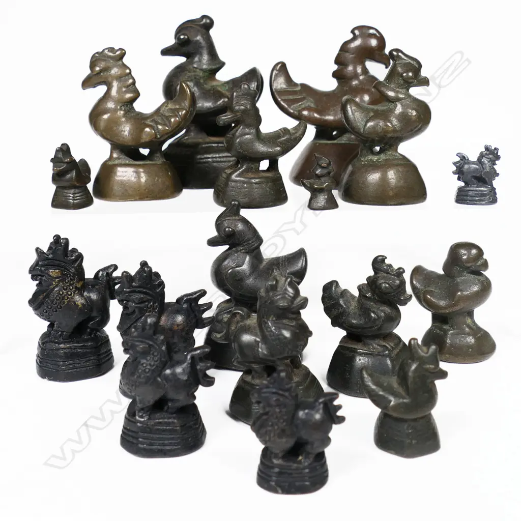 Two mixed sets of Burmese bronze 'opium' weights, of classic bird form Image 1++