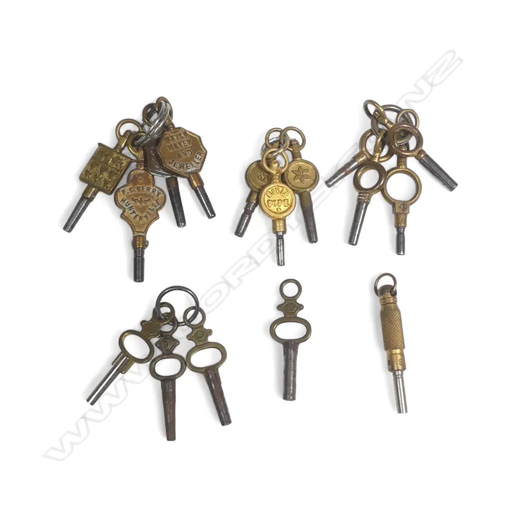 16 various pocket watch keys, two with plaques marked for NZ watchmakers. Image 1++