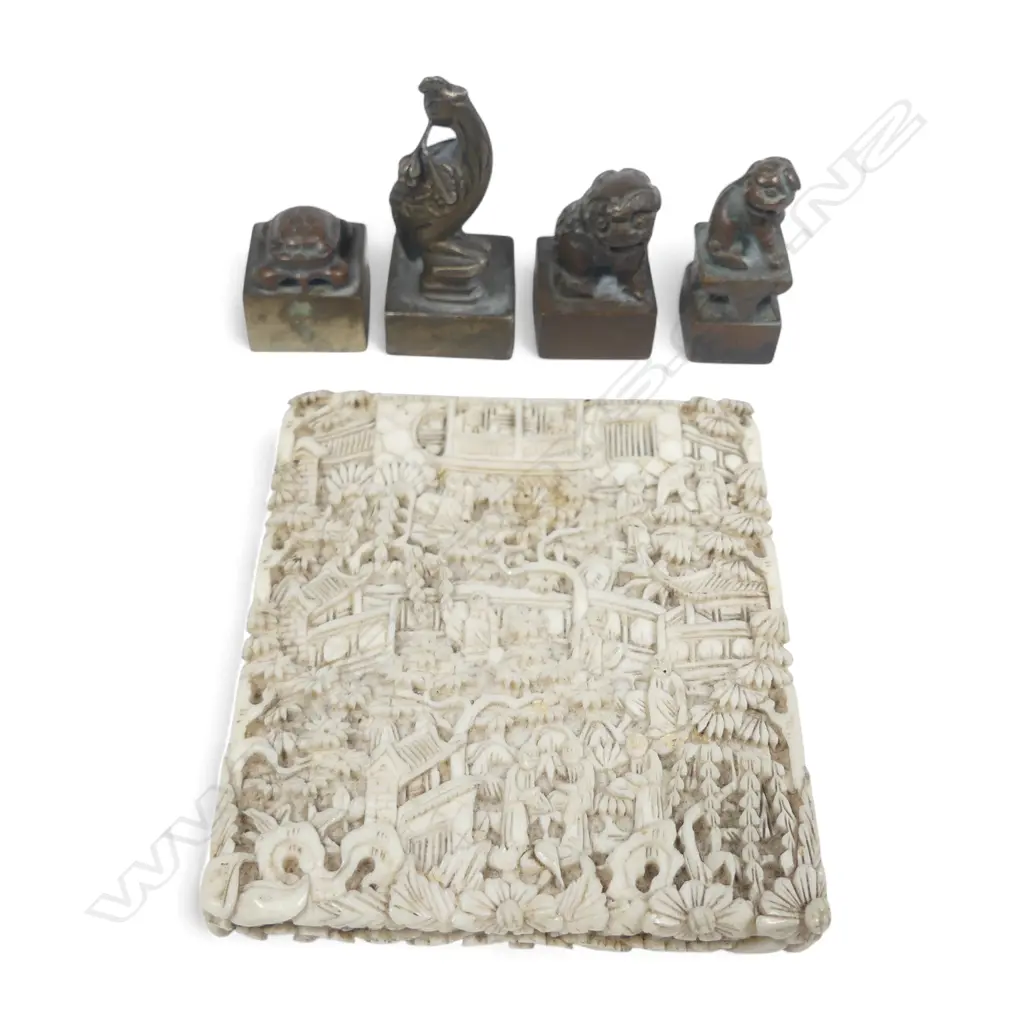 Finely carved Chinese ivory card case, lower section only, 77 x 67mm and four small Chinese bronze chop seals, two engraved. Image 1++