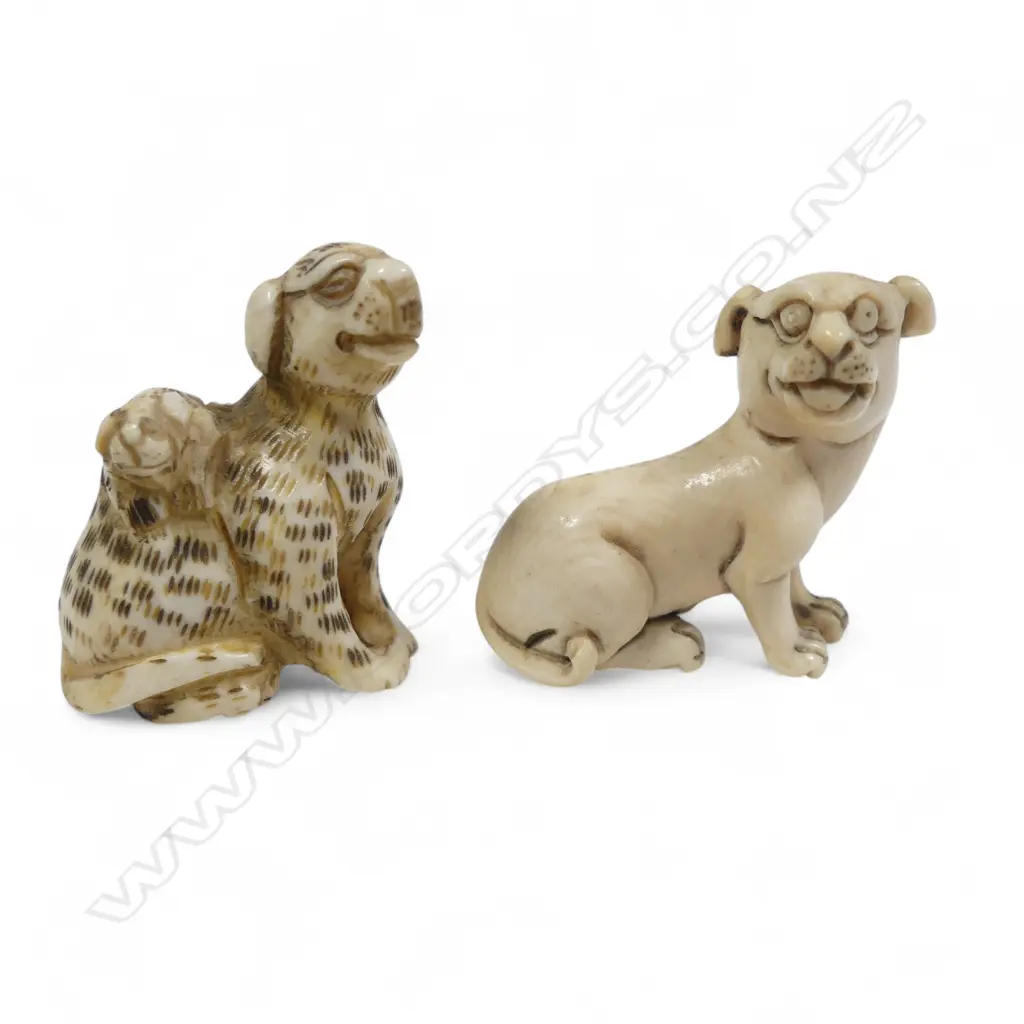 Two small Japanese ivory netsuke - a spotted dog with pup climbing its haunches; and a seated dog. Image 1++