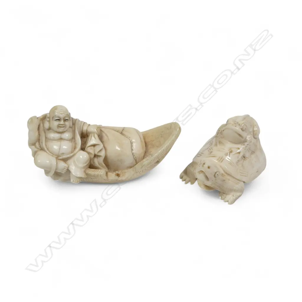 Two small Japanese ivory netsuke - Hotei with treasure sack adrift in a boat (AF), and a frog riding on the back of a tortoise. Both signed. Image 1++