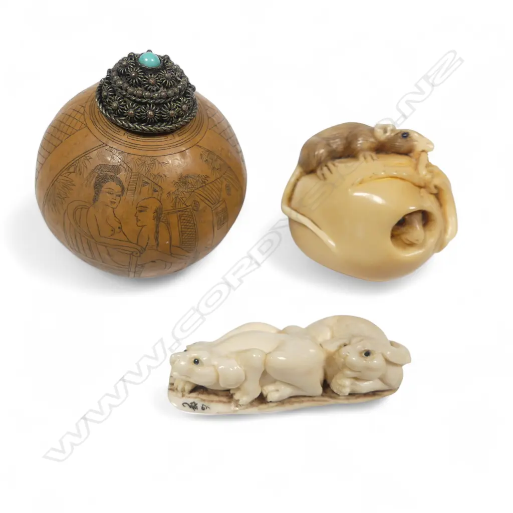 Two Japanese netsuke and a snuff gourd - the ivory netsuke of two hounds; the coroza nut netsuke of a food sack, one rat inside another gnawing on the rope binding; the small spherical gourd with erotic engraving. Image 1++