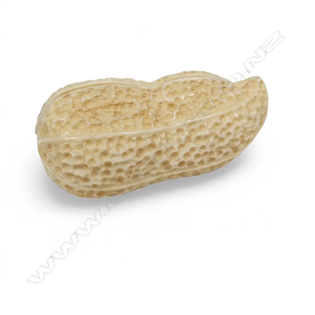 An ivory erotica carved as a groundnut shell, finely joined as two halves revealing a couple in coitus to the interior. H.65mm Image 1++