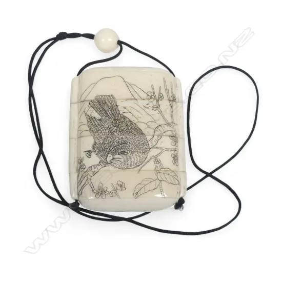 A sectional bone inro, of four compartments, engraved with a boating party to one side and a hawk to the other. H.75mm