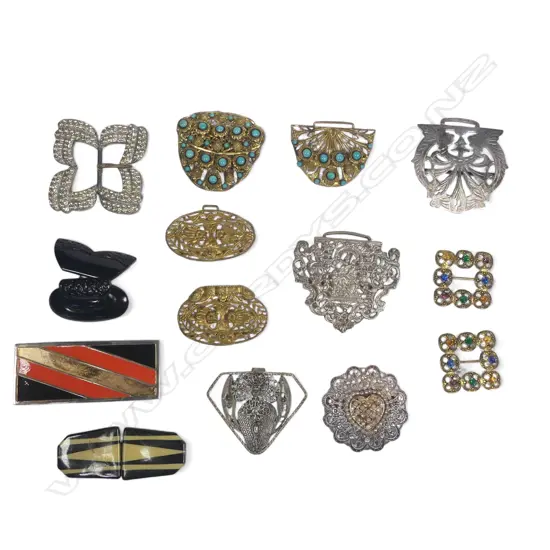 A collection of silver plated, gilt metal and enamelled fancy belt buckles, some half only