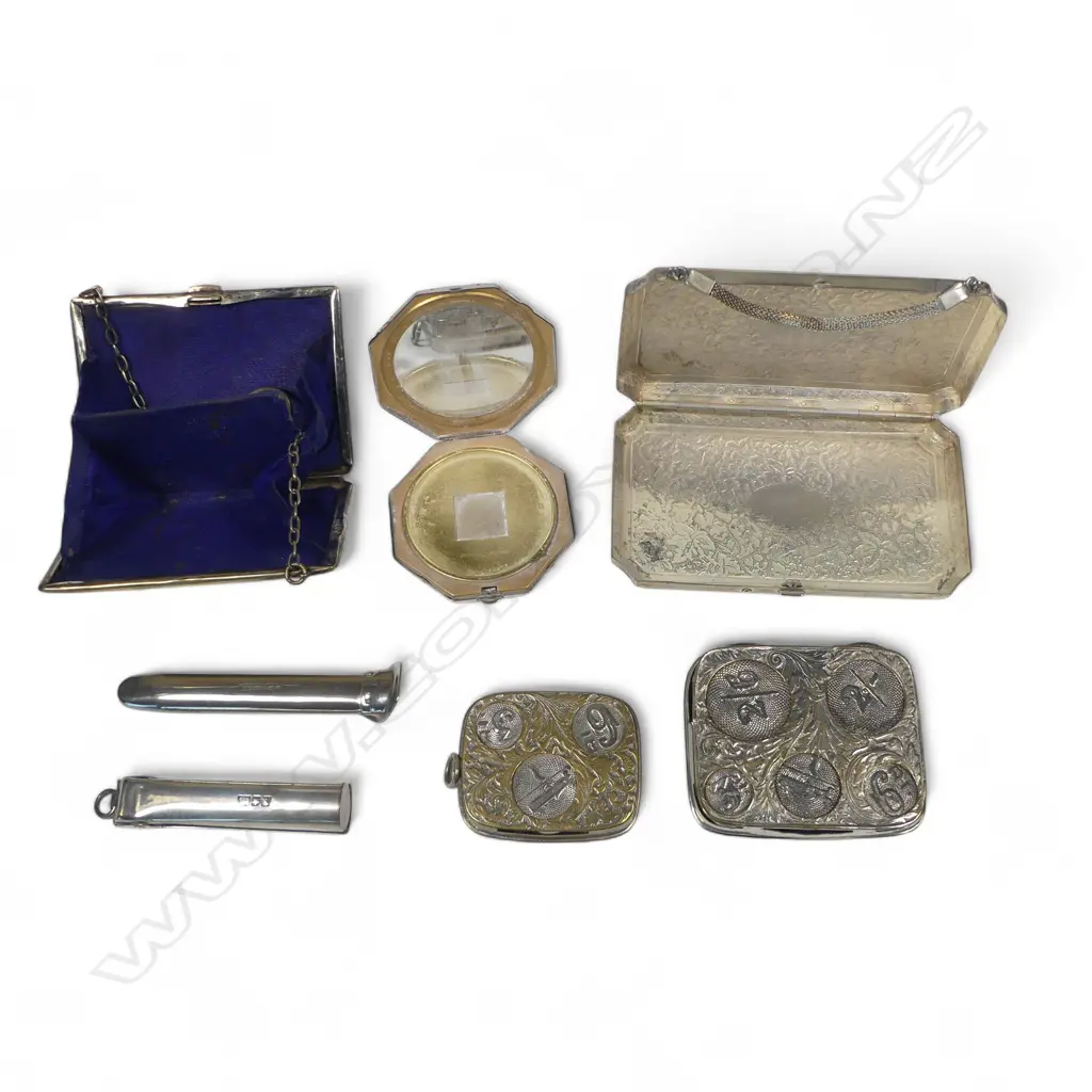 A silver plated visiting card purse, finger purse, two silo coin holders, a powder compact decorated with Guide Rangi, a lapel button hole corsage holder and a cigarette holder case. Image 1++