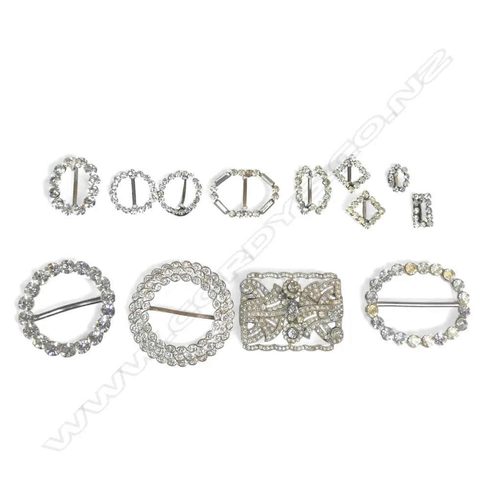 nine vintage diamanté sash choker or scarf buckles on a card; three larger diamanté buckles and a German Art Deco paste brooch Image 1++