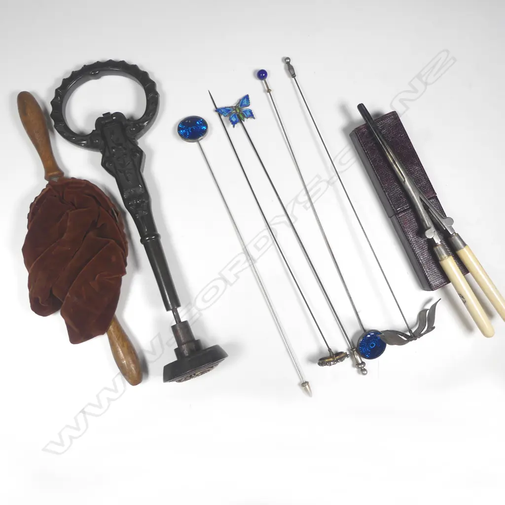 Bakelite parasol handle (with hidden compartments), pair bone handled folding hair tongs (in original case); five hat pins (one silver enamel) church collection bag, and a bone inlaid parasol knob. Image 1++
