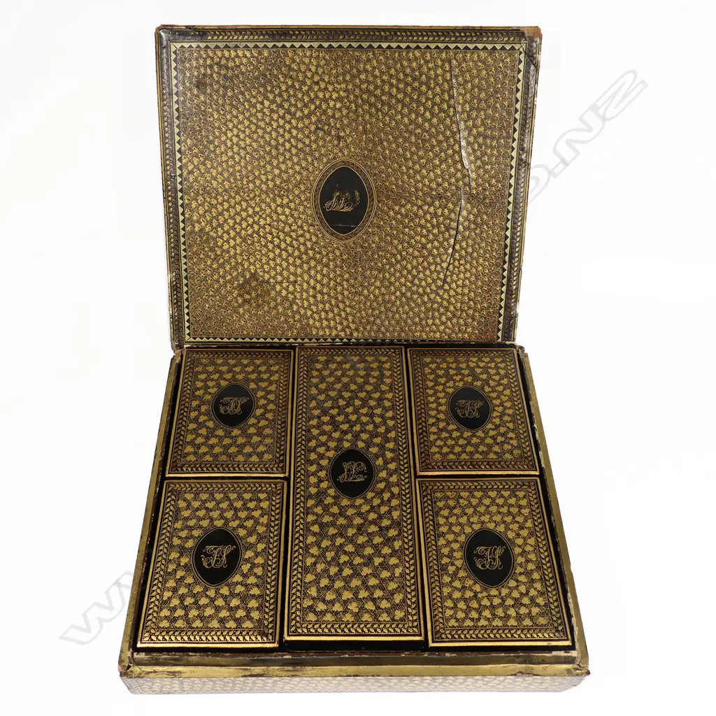 An 18thC multiple boxed set of approximately 310 bespoke engraved Chinese mother-of-pearl gaming counters, housed in a square lidded box holding five further boxes, each gold lacquered and monogrammed 'FS' to the lids, circa 1790 Image 1++