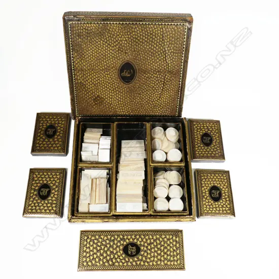 An 18thC multiple boxed set of approximately 310 bespoke engraved Chinese mother-of-pearl gaming counters, housed in a square lidded box holding five further boxes, each gold lacquered and monogrammed 'FS' to the lids, circa 1790
